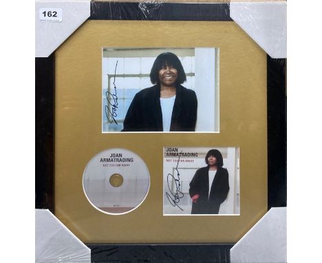 Autograph interest: A framed autographed photograph and CD cover by Joan Armatrading. Frame size 42 x 42cm.