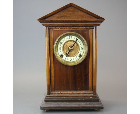 A 19th century oak mantel clock, H. 40cm. Slightly A/F to dial.