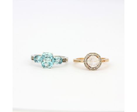 A gold on 925 silver stone set cluster ring and a 925 silver ring set with oval cut blue zircon, (M &amp; O).