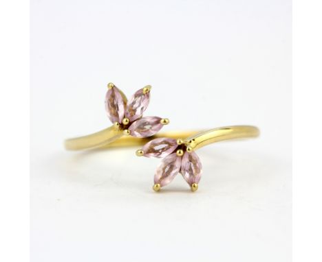 A 9ct yellow gold ring set with marquise cut kunzites, (Q).