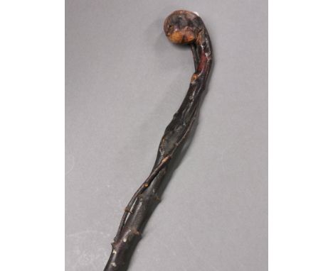 An unusual natural form twisted briar walking stick, L. 85cm.