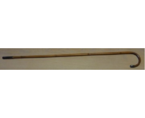 Brewer’s Gauge StickThis ordinary looking bamboo crook handled walking stick has what appears to be cartridge case as a ferru