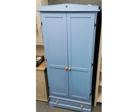 A handmade blue finished wardrobe with fitted lighting and single bottom drawer, 182 x 82 x 55cm.