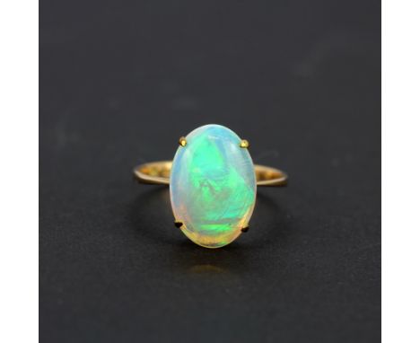 A 14ct yellow gold ring set with a large opal (K).