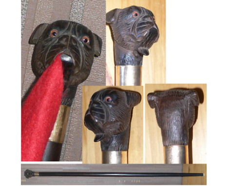 An interesting automated gadget stick. The handle is carved in the form of a dog’s head. The eyes, in red settings, are glass