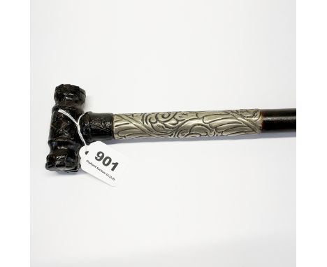 A hand carved hardwood walking stick, the handle resembling folded leather and featuring masonic simbolism. The stick feature