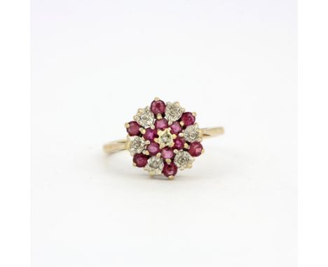 A 9ct yellow gold diamond and ruby set cluster ring, (O).