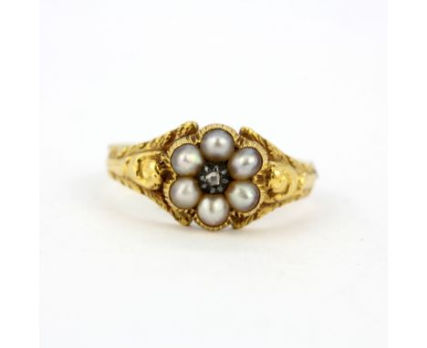 A Victorian yellow metal (tested 18ct gold) mourning ring set with seed pearls and a rose cut diamond, with hair compartment 