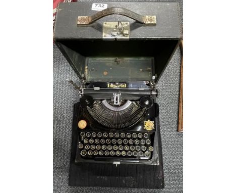 An Imperial portable typewriter with felt pad.