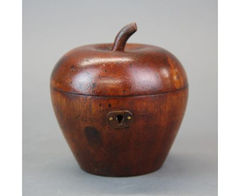 A turned wooden apple tea caddy, Dia. 11cm, H. 11cm.