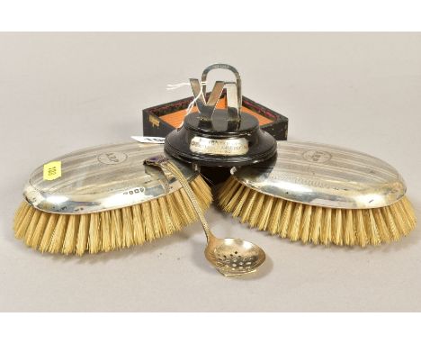 A PAIR OF GEORGE V SILVER MOUNTED OVAL BRUSHES, engraved initials and engine turned, makers A&amp;J Zimmerman Ltd, Birmingham