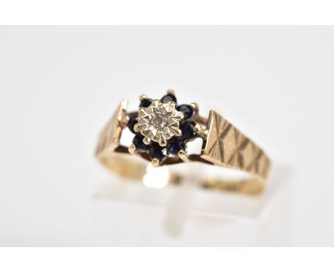 A 9CT GOLD CLUSTER RING, the tiered cluster set with a single cut diamond and circular cut sapphire surround, to the engraved