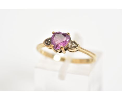 A 9CT GOLD HEART SHAPED RING, designed with heart shaped ruby with heart shape shoulders each set with a single cut diamond, 
