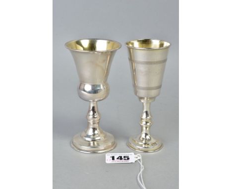TWO SMALL SILVER GOBLETS, one of plain design with a thistle shape, hallmarked London 1968, the other with an engine turned d