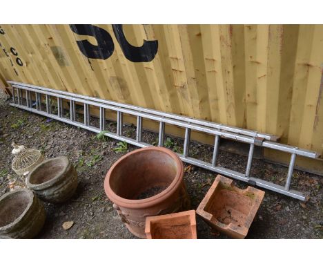 AN ALUMINIUM DOUBLE EXTENSION LADDER, approximate height 384cm