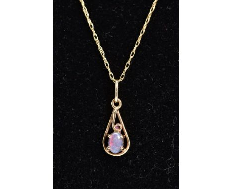 AN OPAL PENDANT NECKLACE, the yellow metal openwork pendant set with an oval cut doublet, suspended from a fine double link c