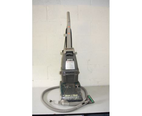 A HOOVER BRUSH 'N' WASH CARPET CLEANER, with upholstery attachment (PAT pass and working)