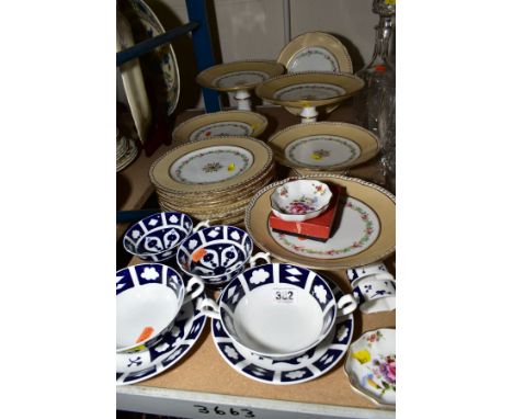 A CONTINENTAL CHINA DESSERT SERVICE having gilt decoration to the wavy beige rim, inner stencilled and hand painted floral de