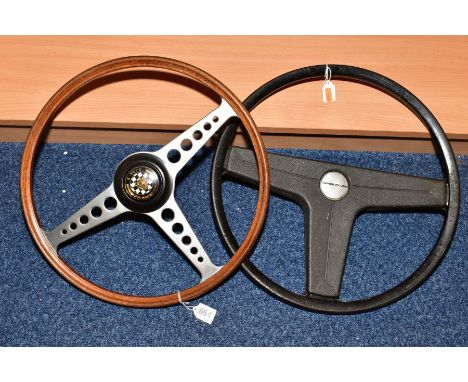 AN E-TYPE JAGUAR STEERING WHEEL, wooden rim with aluminium spokes and extension sleeve (sleeve marked AJW 880H in pen to unde