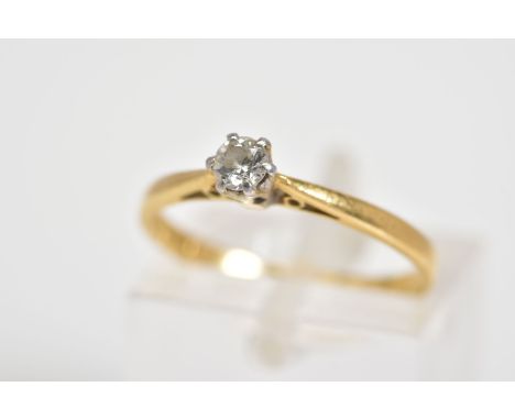 AN 18CT GOLD SINGLE STONE DIAMOND RING, set with a round brilliant cut diamond within a six claw setting, to the tapered shou