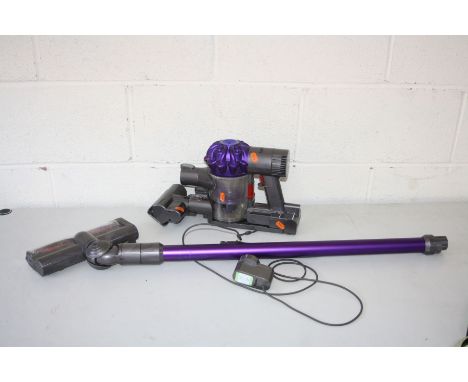 A DYSON SV03 HAND HELD VACUUM CLEANER with floor extension, head and charging wall bracket (PAT pass and working)