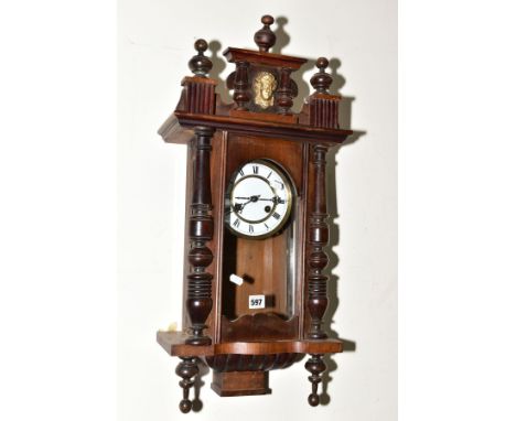 A CHIMING DROP CASE WALL CLOCK, having a white enamel dial and Roman numerals (overwound) (pendulum and key)