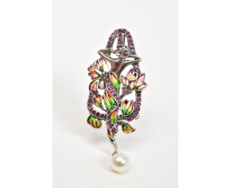 A PLIQUE A JOUR BROOCH, in the form of a lady with red, yellow and green enamel flowers, with a circular cut ruby surround, s