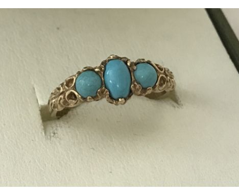 A ladies 9ct gold classic dress ring set with 3 turquoise stones. Ring size O½.