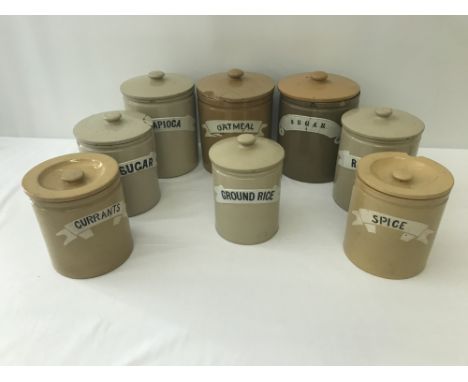 8 vintage ceramic kitchen grocery named storage jars. Comprising: Currants, Oatmeal, M. Sugar, Tapioca, Sugar, Raisins, Spice