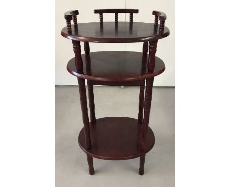 A vintage mahogany coloured 3 tier hall table. With turned detail to uprights and small draw to front. Approx. 79cm tall.