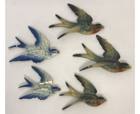 A small collection of vintage wall hanging flying bird ornaments (2 blue &amp; white ones a/f).