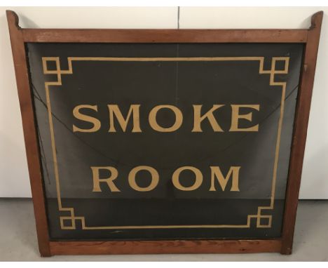 A vintage wooden framed pub "Smoke Room" sign on wire mesh. Letters and border in gold. Approx. 75cm x 81cm.