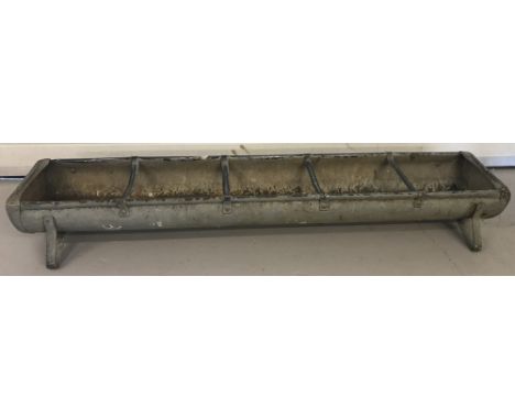 A vintage animal feeding trough. Ideal for using as a garden planter. Approx. 156cm long.