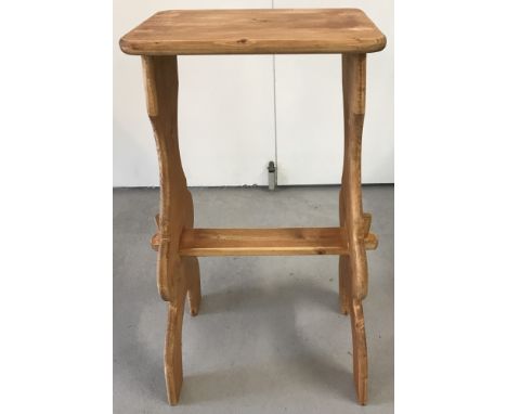 A vintage pine high stool with shaped legs. Approx. 72cm tall.