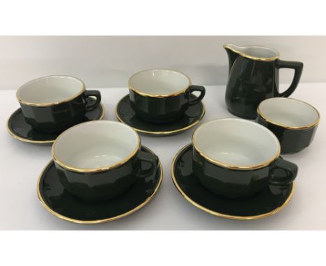 A vintage green &amp; gold ceramic coffee set. Comprising 4 cups &amp; saucers, milk jug and sugar bowl.