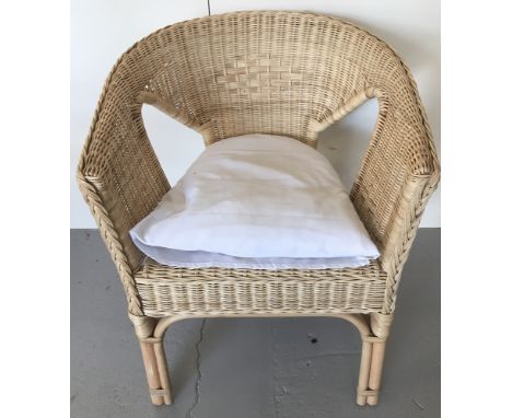 A modern light wood framed cane conservatory chair with diamond weaved pattern to back.