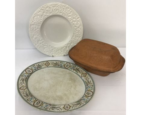 A vintage large meat plate with bird decoration to rim. Together with a terracotta romertopf baker and a modern Italian white
