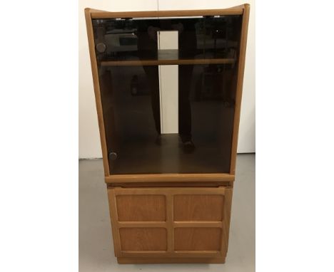 A retro light wood 'Nathan' media cabinet with glass door, lift up lid and bottom cupboard. Approx. H112cm x W51½cm x D45cm.