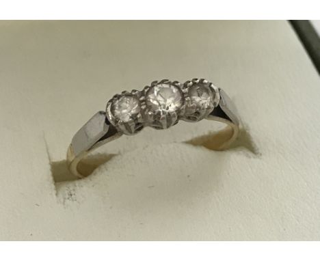 A ladies 18ct gold and palladium Past, Present and Future diamond set trilogy ring. Total diamond carat .20, ring size M½. To