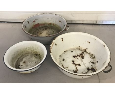 2 large vintage 2 handled circular enamel bowls together with another smaller enamel bowl. Largest approx. 49.5cm diameter.
