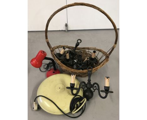 A set of 3 electrical candelabra wall sconces in black metal.Together with a large wicker basket, a Belling bed warmer and a 