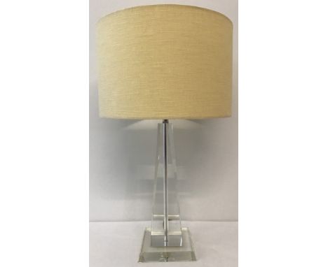 A modern Art Deco style crystal base lamp. Obelisk style with square cut base. Complete with cream shade. Approx. 62cm tall i