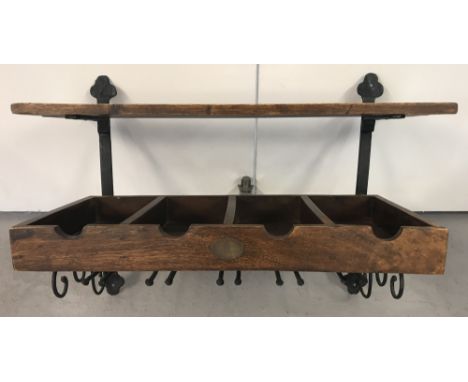 A modern wrought iron and dark wood "Comptoir de Famille" wall hanging kitchen rack. With top shelf, sectional compartments a