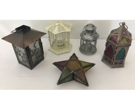 A collection of 5 metal and glass tea light lanterns to include Moroccan design.