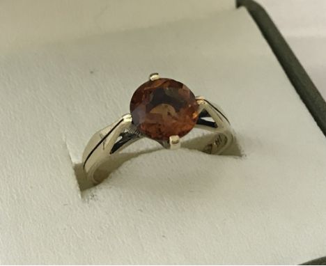 A ladies 9ct gold round cut citrine solitaire ring. Size P.