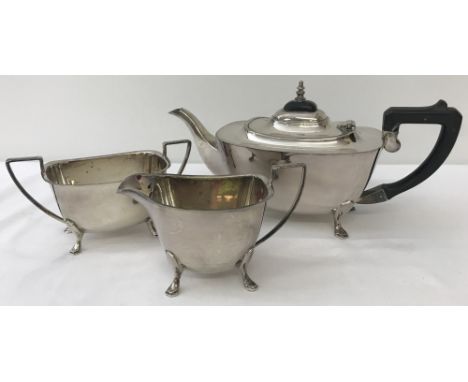 A silver plated Art Deco style tea set comprising a 4 footed teapot, milk jug and sugar bowl.Comprising a footed teapot, milk