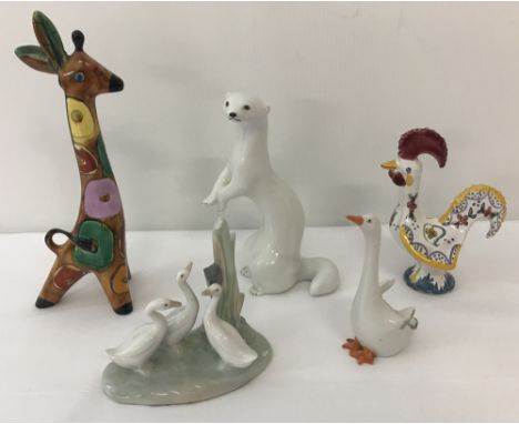 A small collection of ceramic animal and bird figurines.Comprising a vintage Lomonosov stoat in ermine, together with a Nao g