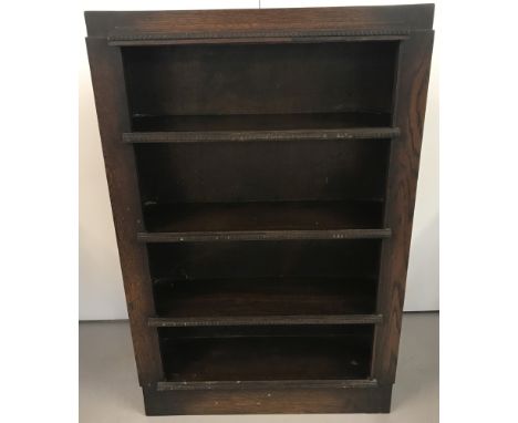 An Art Deco dark wood 4 shelf bookcase with beading detail to shelf fronts. Approx. 116cm tall x 76cm wide.