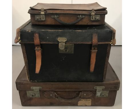 3 vintage suitcases. A large heavy brown leather case with original "Norwich Thorpe" luggage labels. Together with a square s