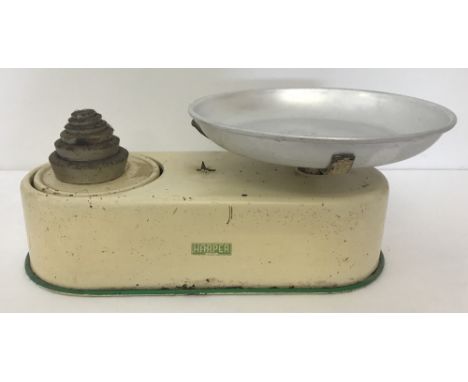 A vintage set of cream kitchen scale with weights by Harper.